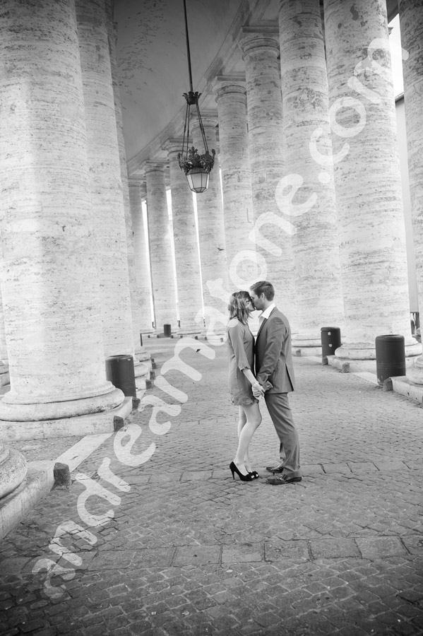 black-white-photo-rome-037 Kissing under collonade at the Vatican in Italy Saint Peter's