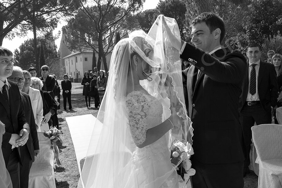 wedding-italy-17-1412 The groom taking off the the bride's veil