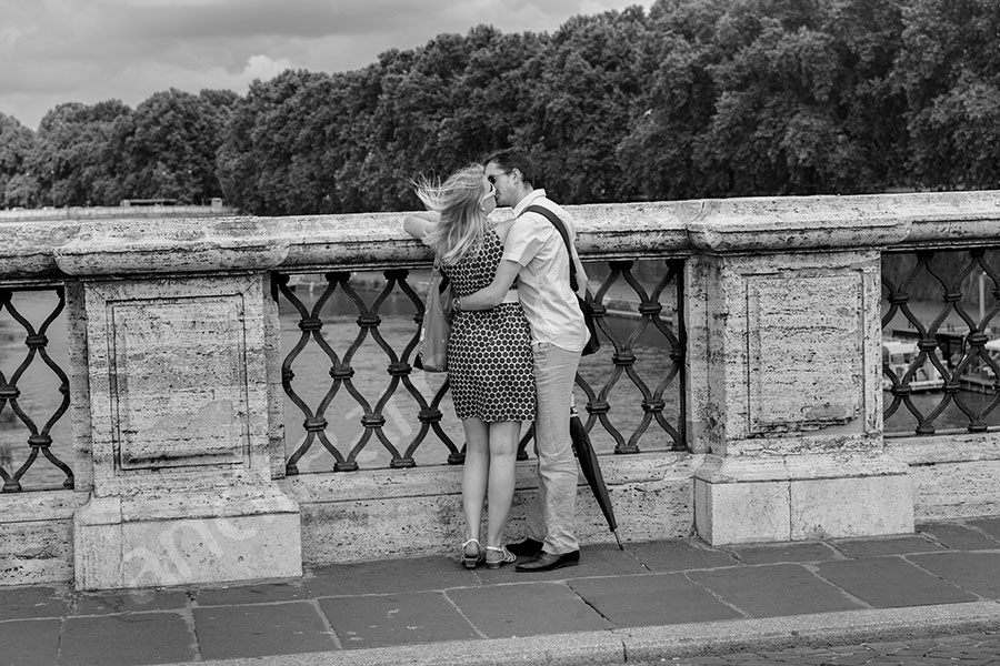 proposal-rome-6712-001 Couple kissing after she said yes.