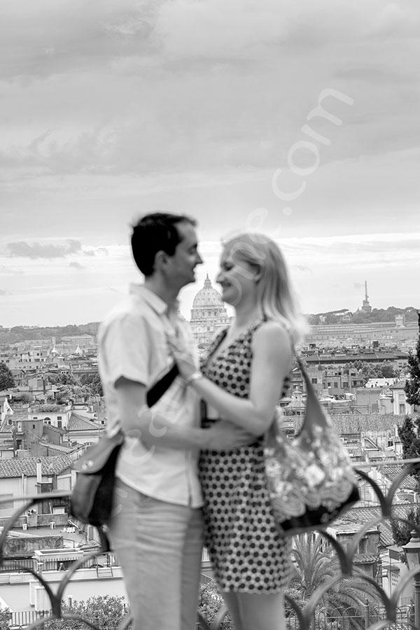 proposal-rome-6712-023 Black and white picture of couple at Parco del Pincio overlooking Saint Peter's church