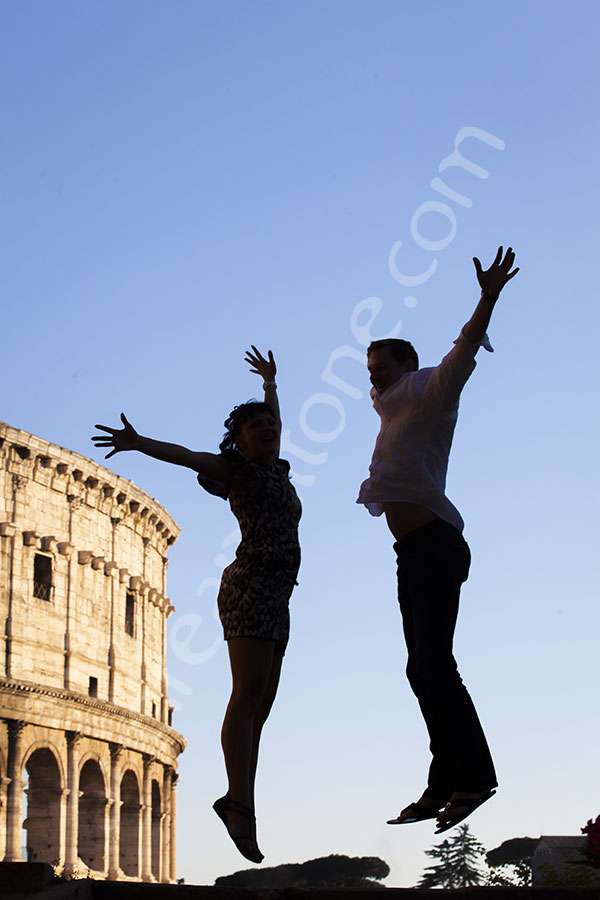 photographer-rome-1912-082 Best engagement photographers in Rome Italy. Couple jumping in front of the Roman Colosseum