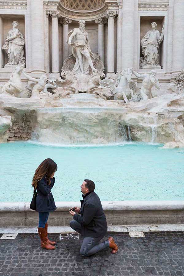 Early morning Trevi fountain Rome proposal dropping the question by the water edge