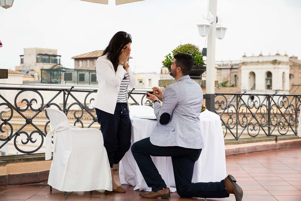 Man proposing down on one knee