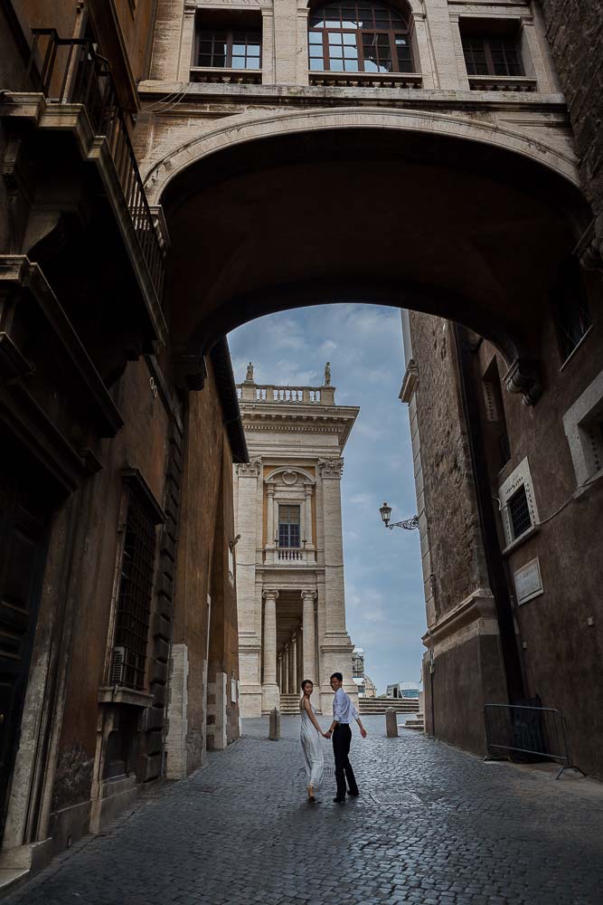 Romantic walk underneath a roman bridge
