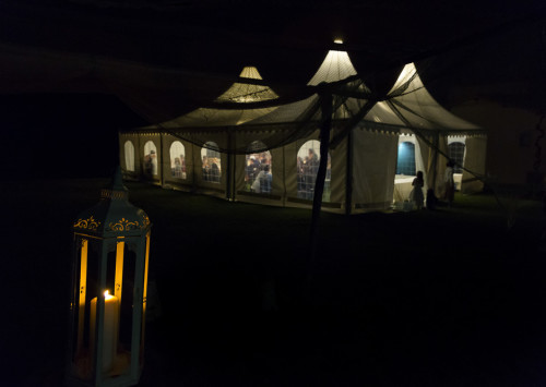 30-wedding-reception-tent Night time view of the dinner tent lit up in the dark