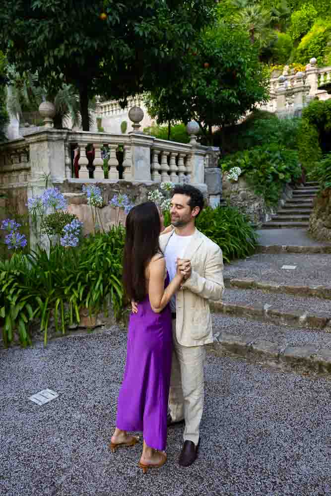 Holding on to each other while subject of photography pictures as attention is given to one another in the lush reag gardens of the Hotel