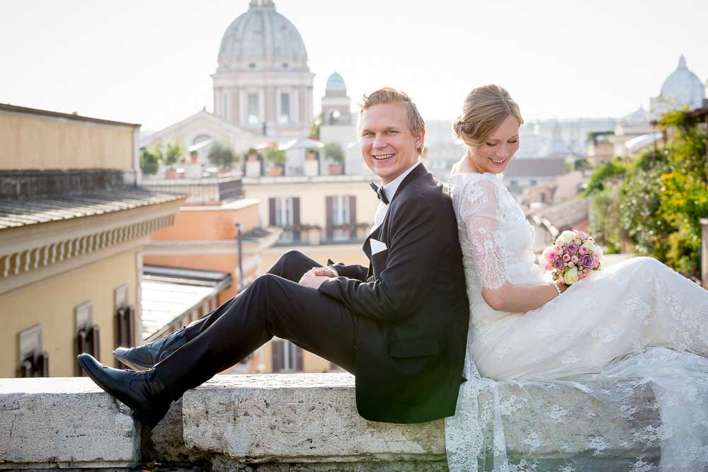 Groom and bride portrait before the Roman rooftops