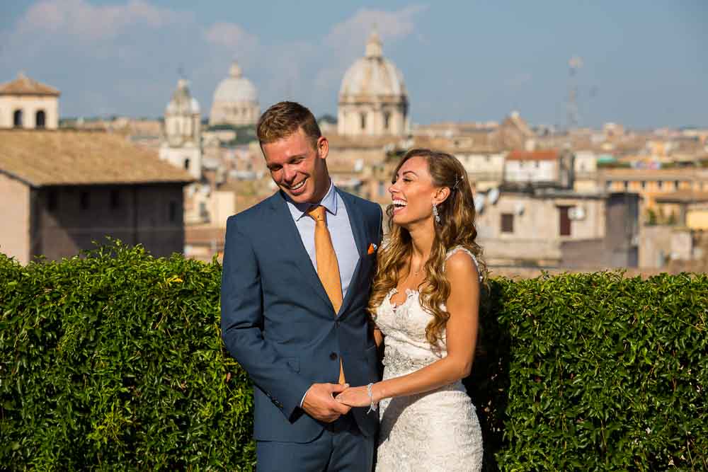 Laughing and having fun overlooking the roman rooftops