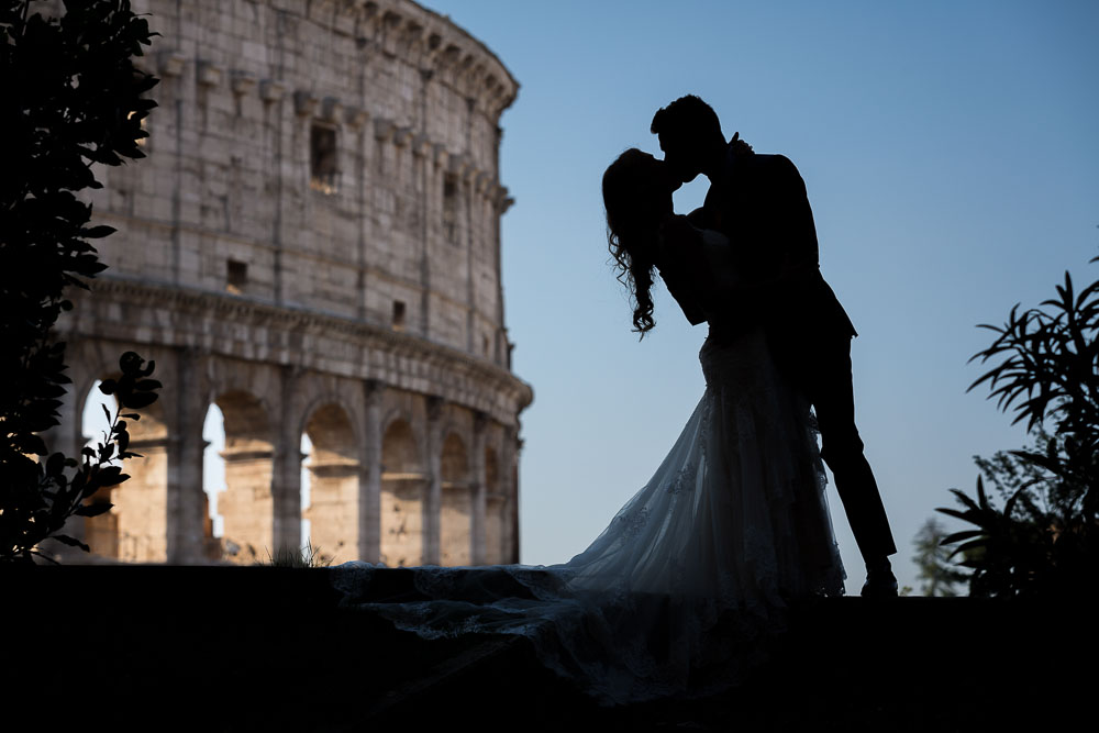 Silhouette image of a couple in love taking matrimonial photos in Italy
