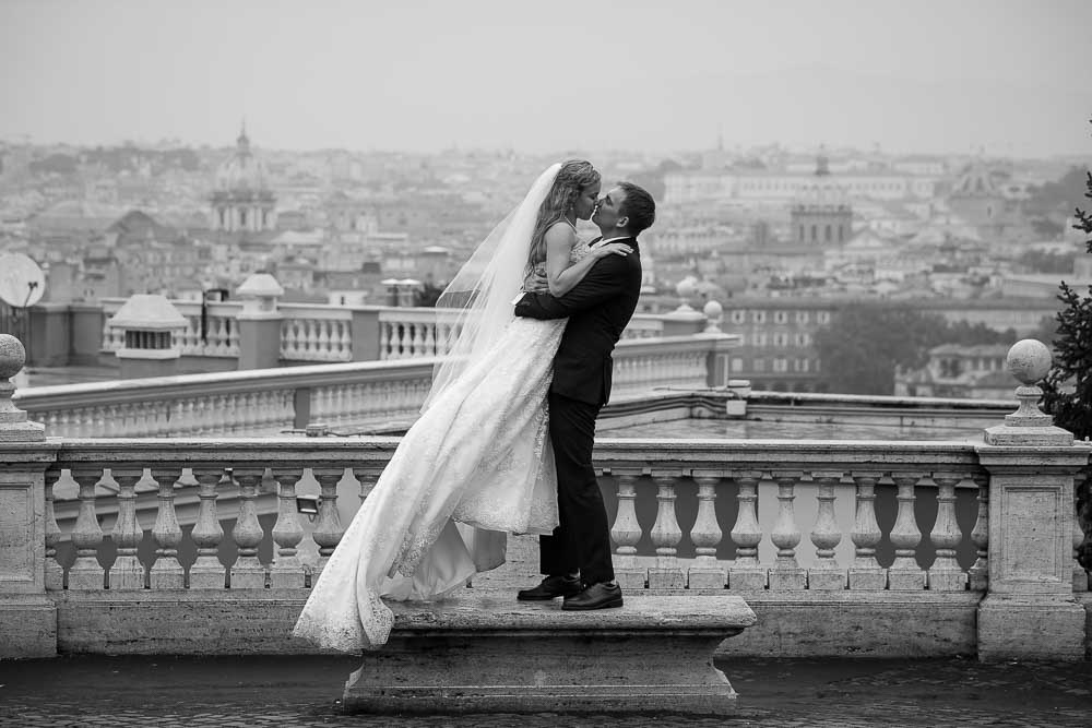Just married and taking wed photos during a photo session overlooking the eternal city from above 