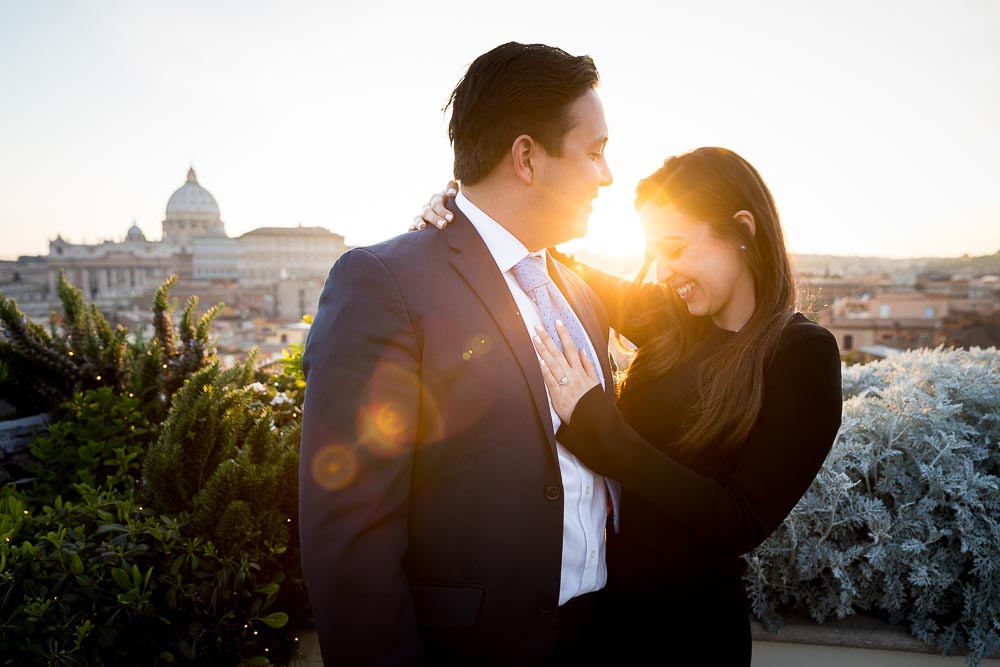 Sunset engagement picture taken during a Rome photoshoot in Italy. Just engaged overlooking the beautiful roman skyline at sundown or golden hour