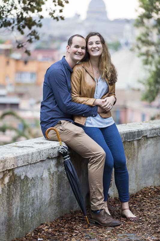 Couple portrait posed for an engagement photograph looking into the photographic camera and smiling