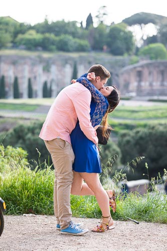 surprise-proposal-sequence-009 kissing couple at the Coliseum with the forum in the background