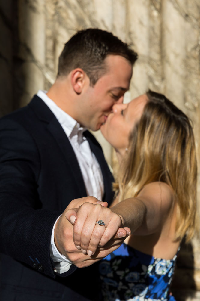 Wedding ring couple close up while kissing