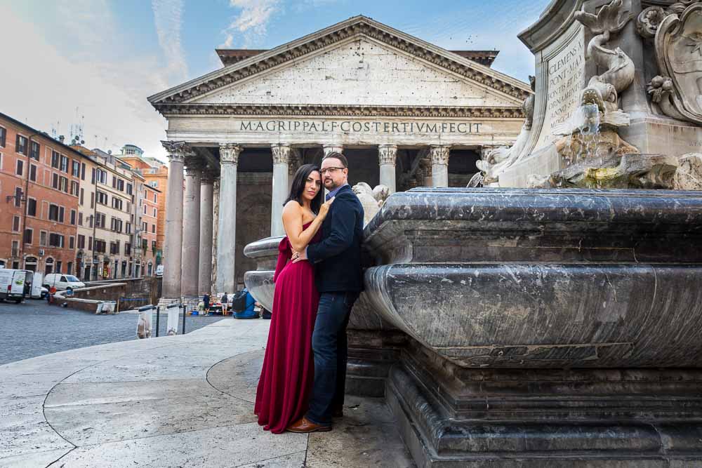 Honeymoon portrait picture standing next to the central obelisk water fountain with the roman pantheon building background