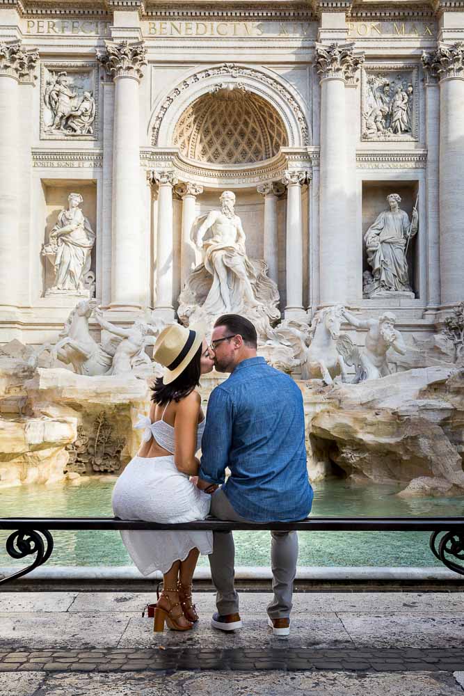 Kissing during a photographer session Trevi fountain. Image by Matone photographer studio in Italy