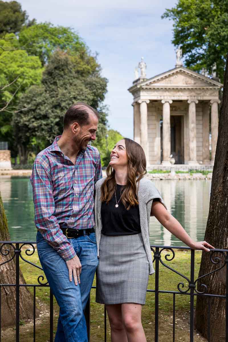 Engagement portrait picture with Villa Borghese's lake and temple background