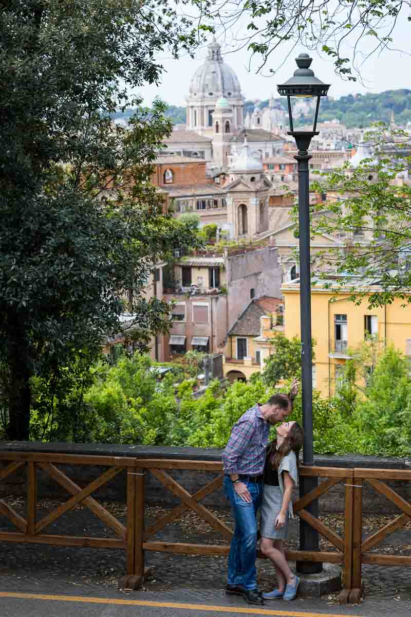 Kissing with the city view as backdrop