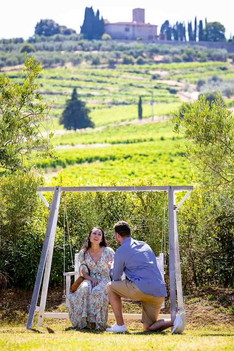 Jumping for joy during and engagement session after a surprise proposal