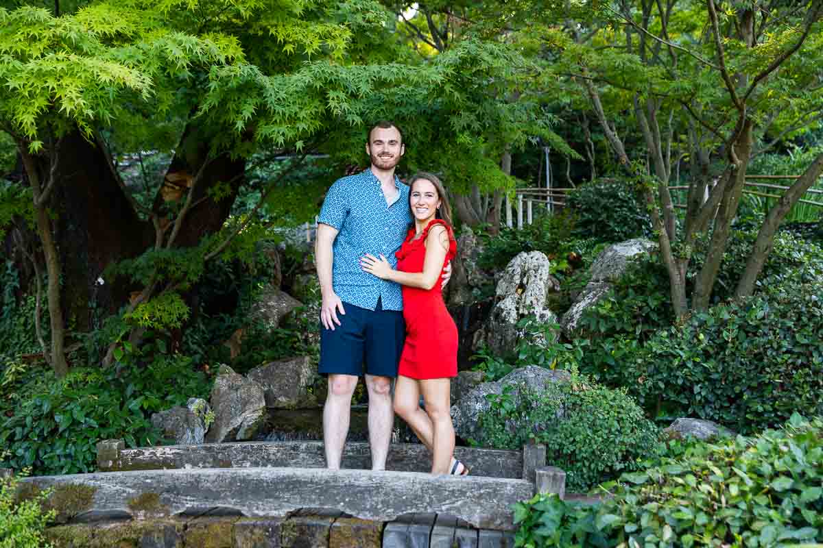 Couple portrait picture posed on the wooden bridge 