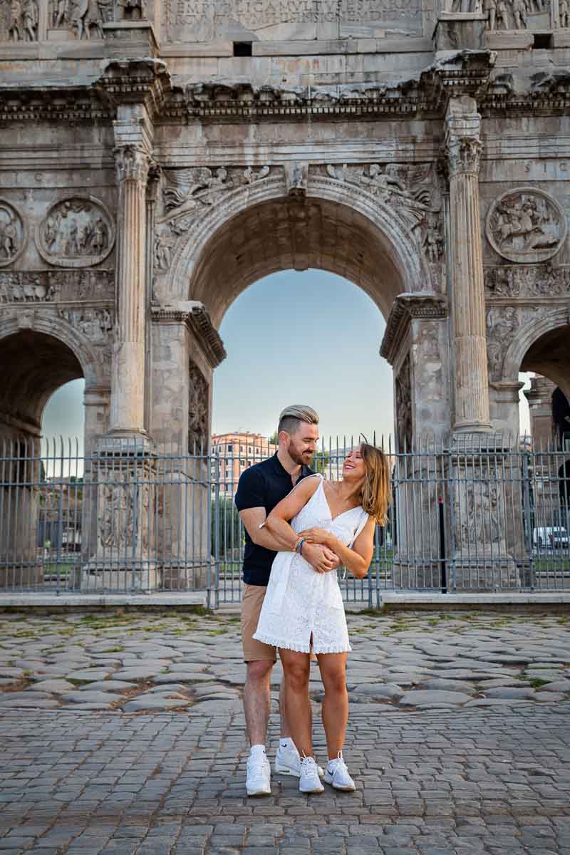 Couple portrait picture standing before the arch of Constantine 