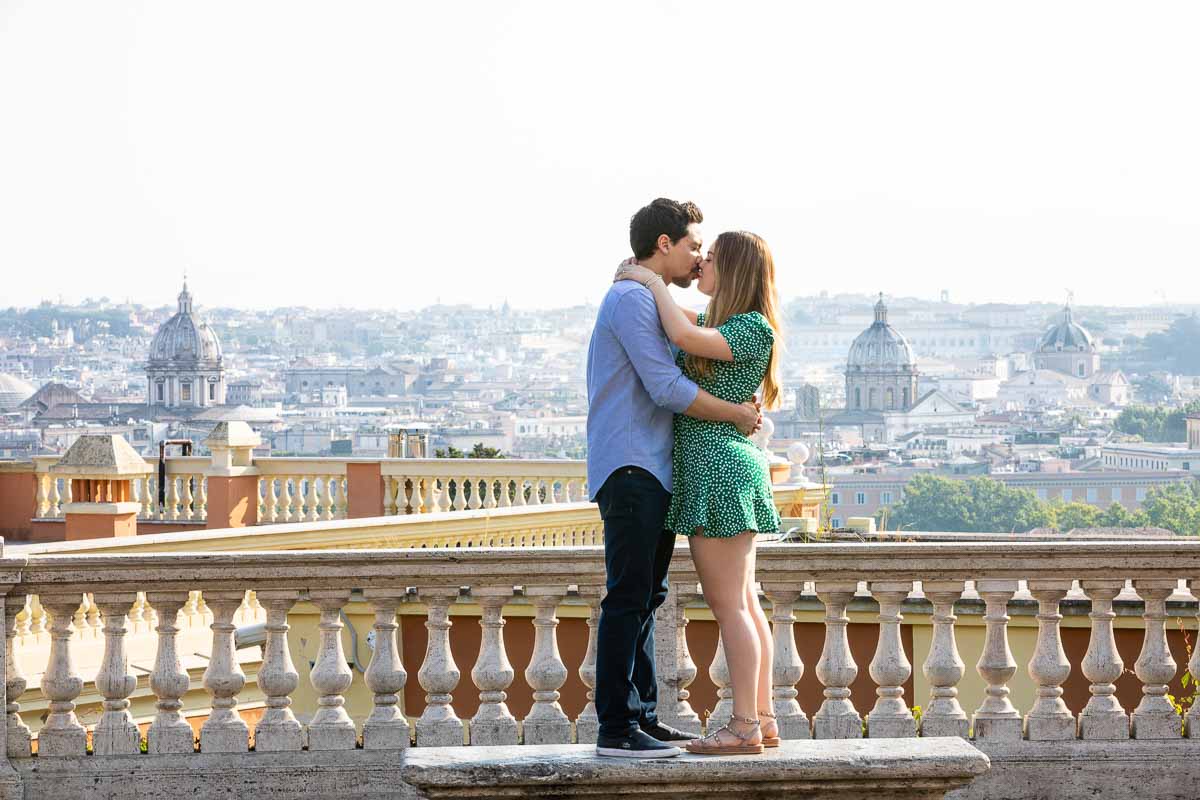In love over the ancient city posing on a marble bench with the city view crisp clear in the backdrop photoshooting