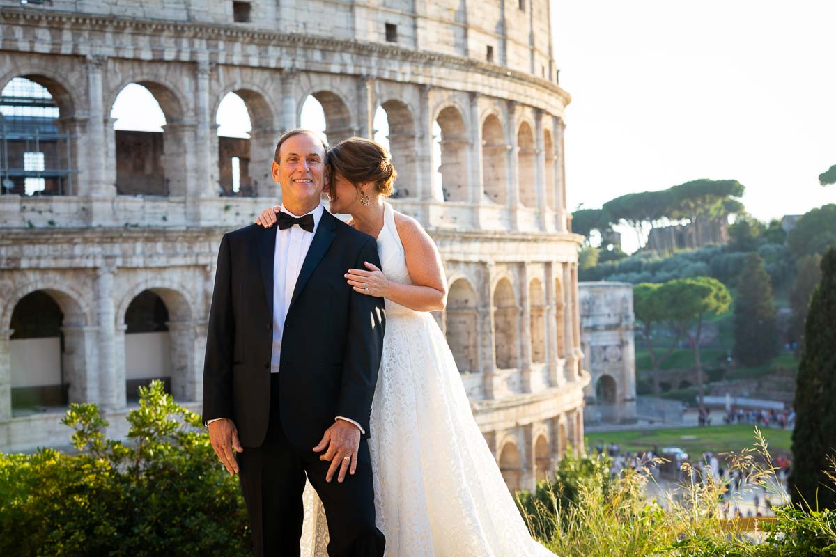Posing picture of the bride and groom taking photos at Coliseum