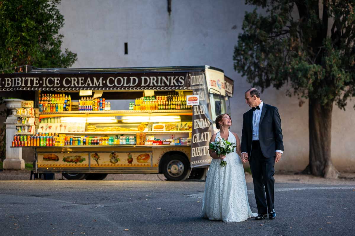 Walking together at the end of day with a typical drinks selling stand