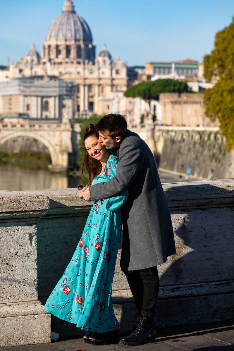 Taking pictures together on Ponte Umberto I bridge found before Saint Peter's dome in the far distance