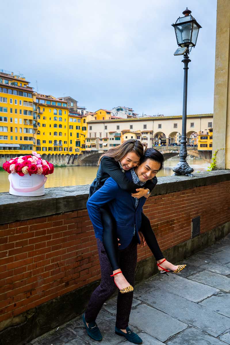 Couple pick me up ride piggyback ride. Couple PhotoShoot in Florence Italy