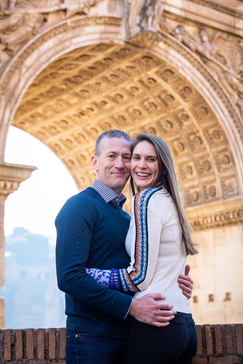 Couple close up honeymoon photo portrait taken underneath a roman arch