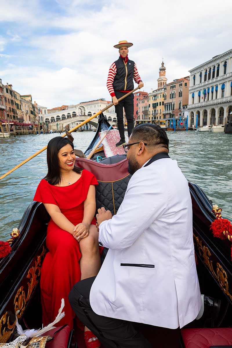 Jumping for joy during and engagement session after a surprise proposal