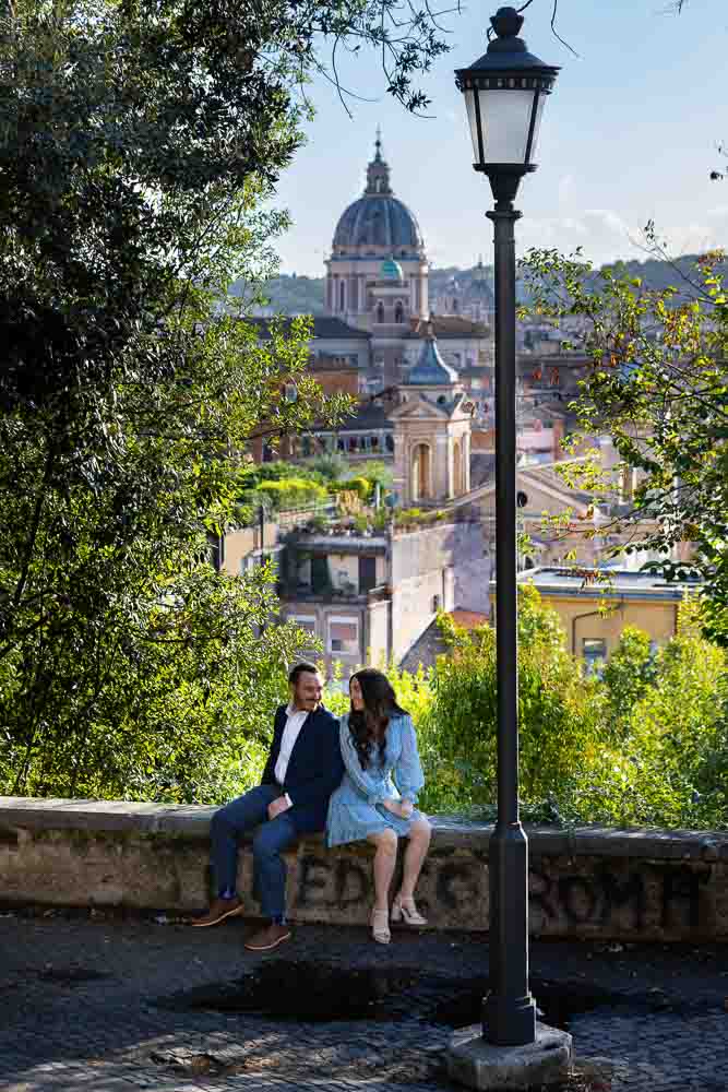 Engagement photo session sitting down before the ancient roman city