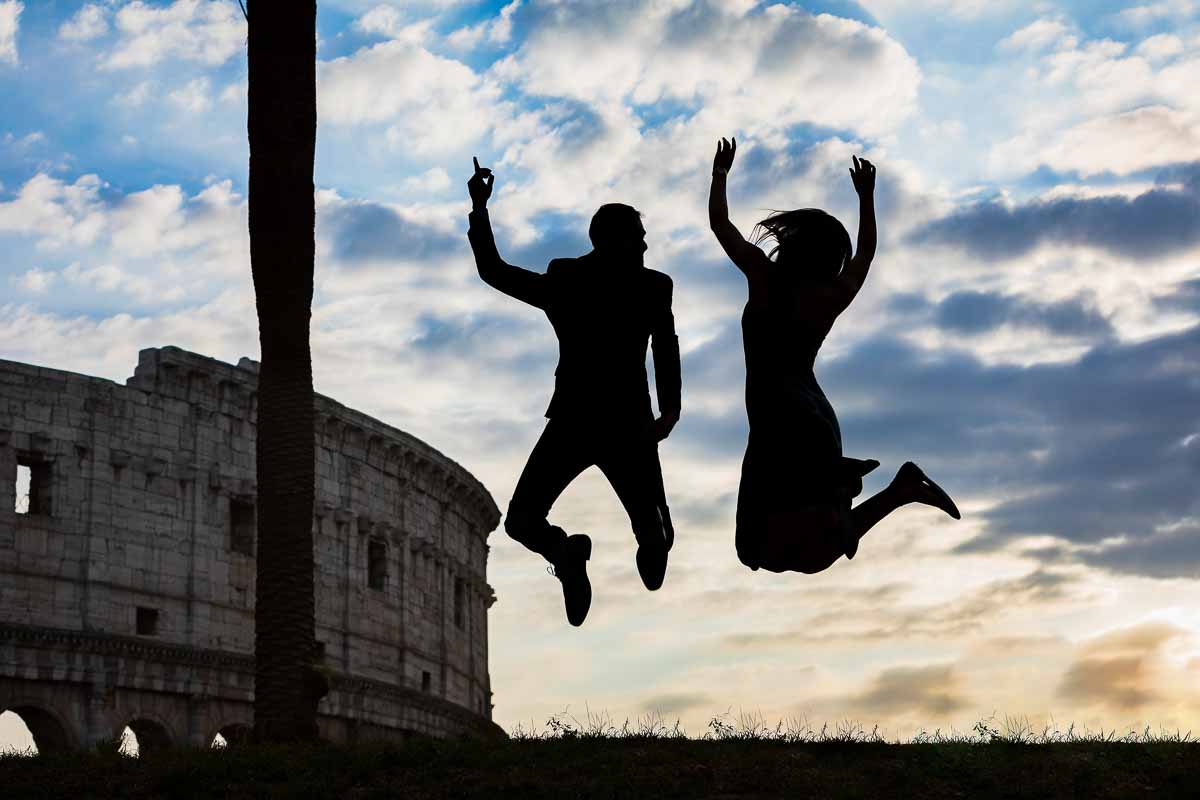 Jumping in air Colosseum during a roman photoshoot