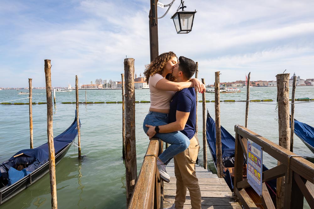 Taking engagement pictures by docks open sea