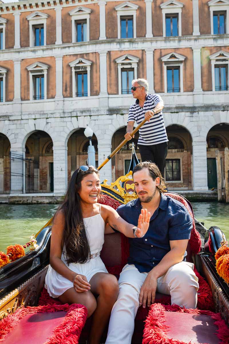 Looking at the engagement ring while riding on a gondola after a surprise proposition in Italy 