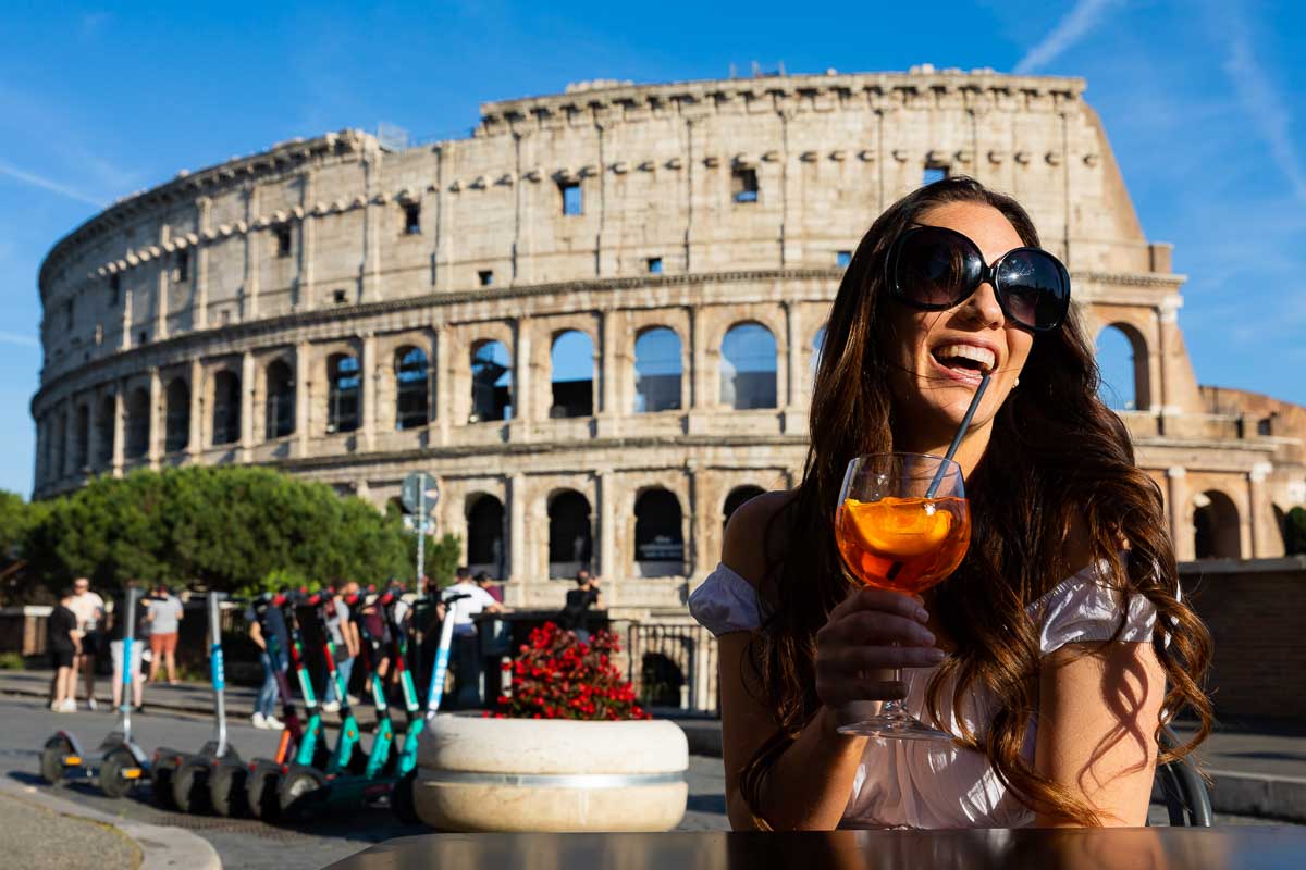 Spritz drink break. Taking fun pictures in Rome during a solo fashion photoshoot at the Roman Coliseum Photography