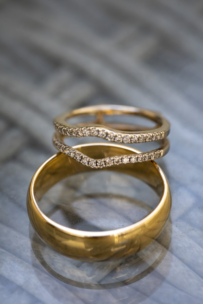 The rings photographed on a glass table