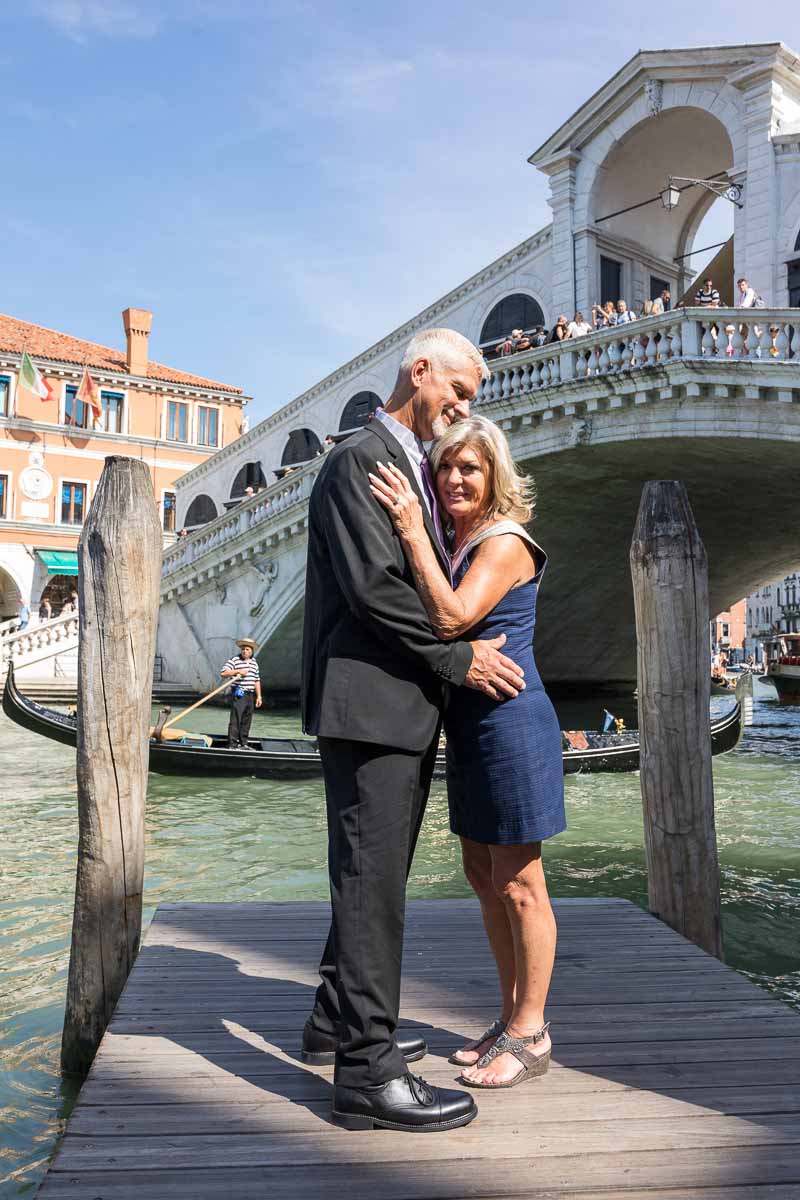 Rialto bridge portrait. Standing on a wooden jetty in front of the famous bridge