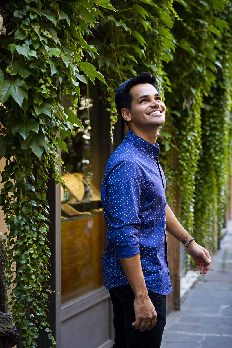 Posing by green Ivy leaves found on the streets of Rome Italy while walking during a model photo shoot