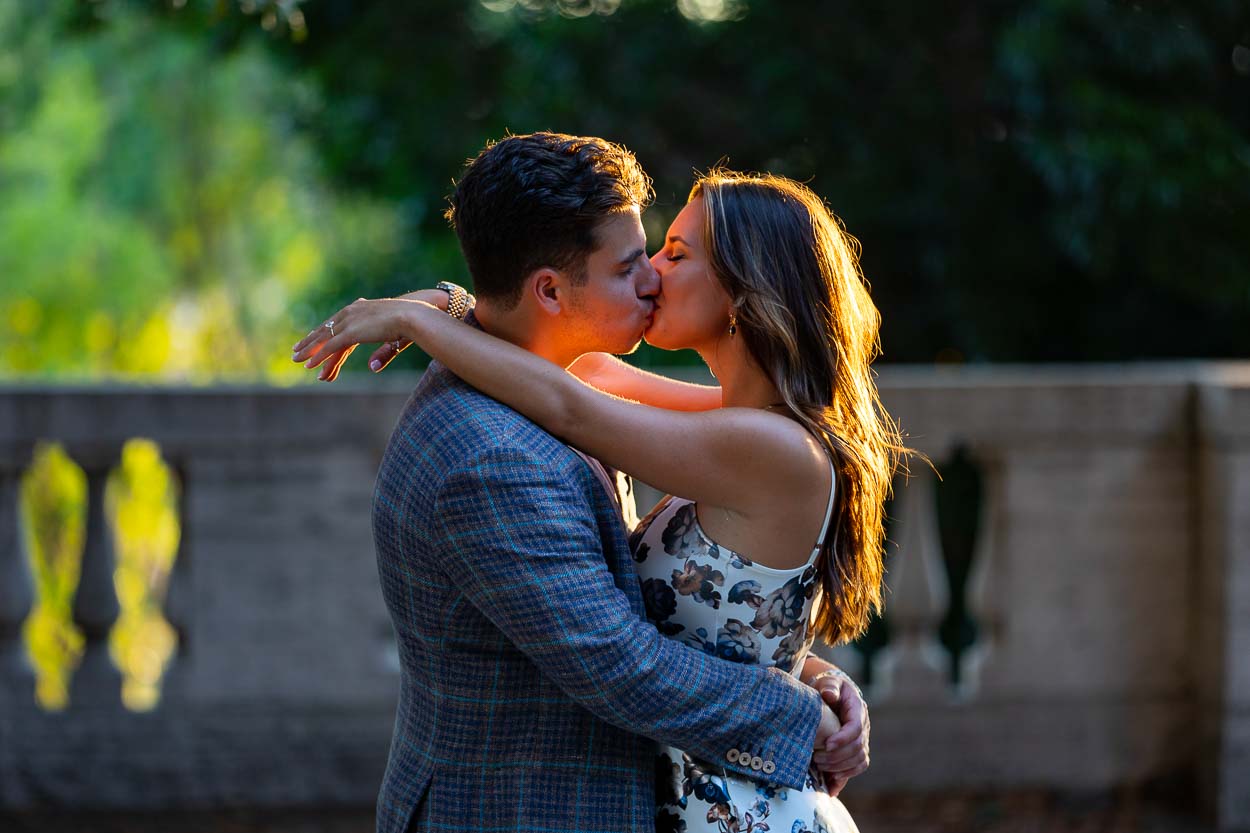 Kissing together at sunset in one of the most scenic roman photoshoot location