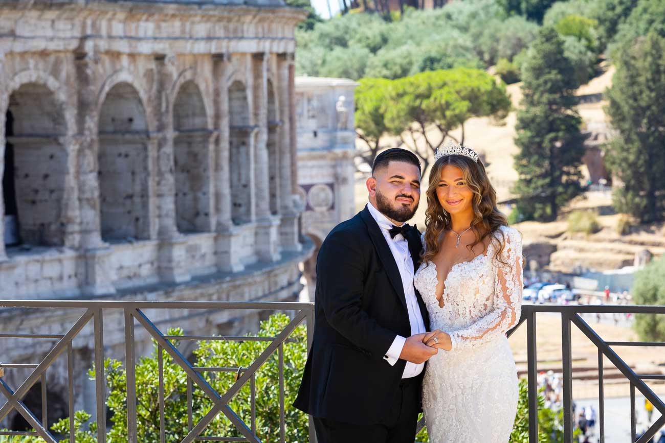 Just married portrait taken Roman Colosseum end wedding day in Roma