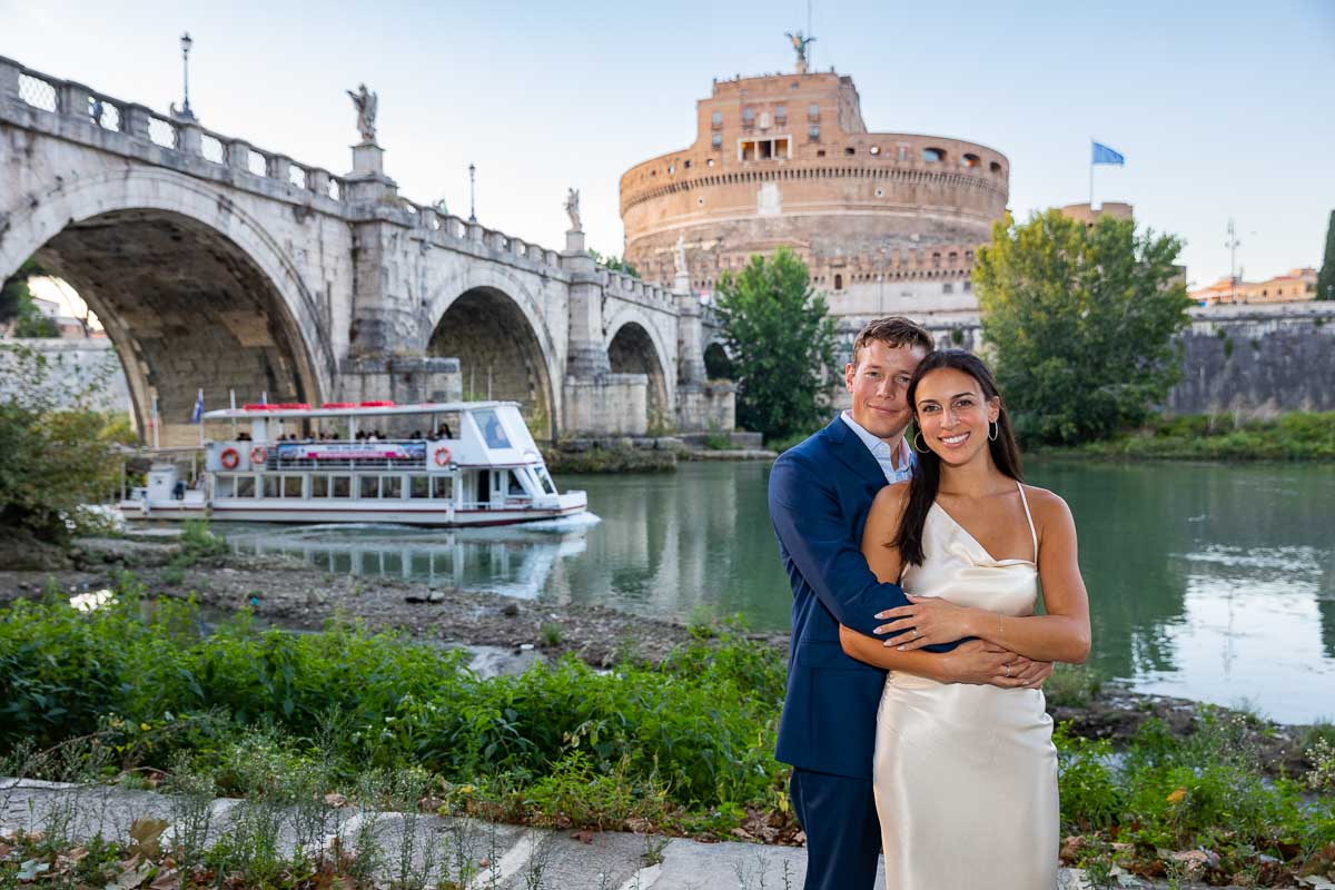 Couple portrait during a photography session with a local river boat as backdrop