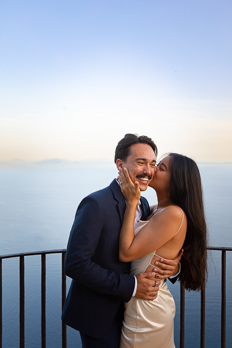 Close up couple portrait photography on Terrazza dell'Infinito next metal railing