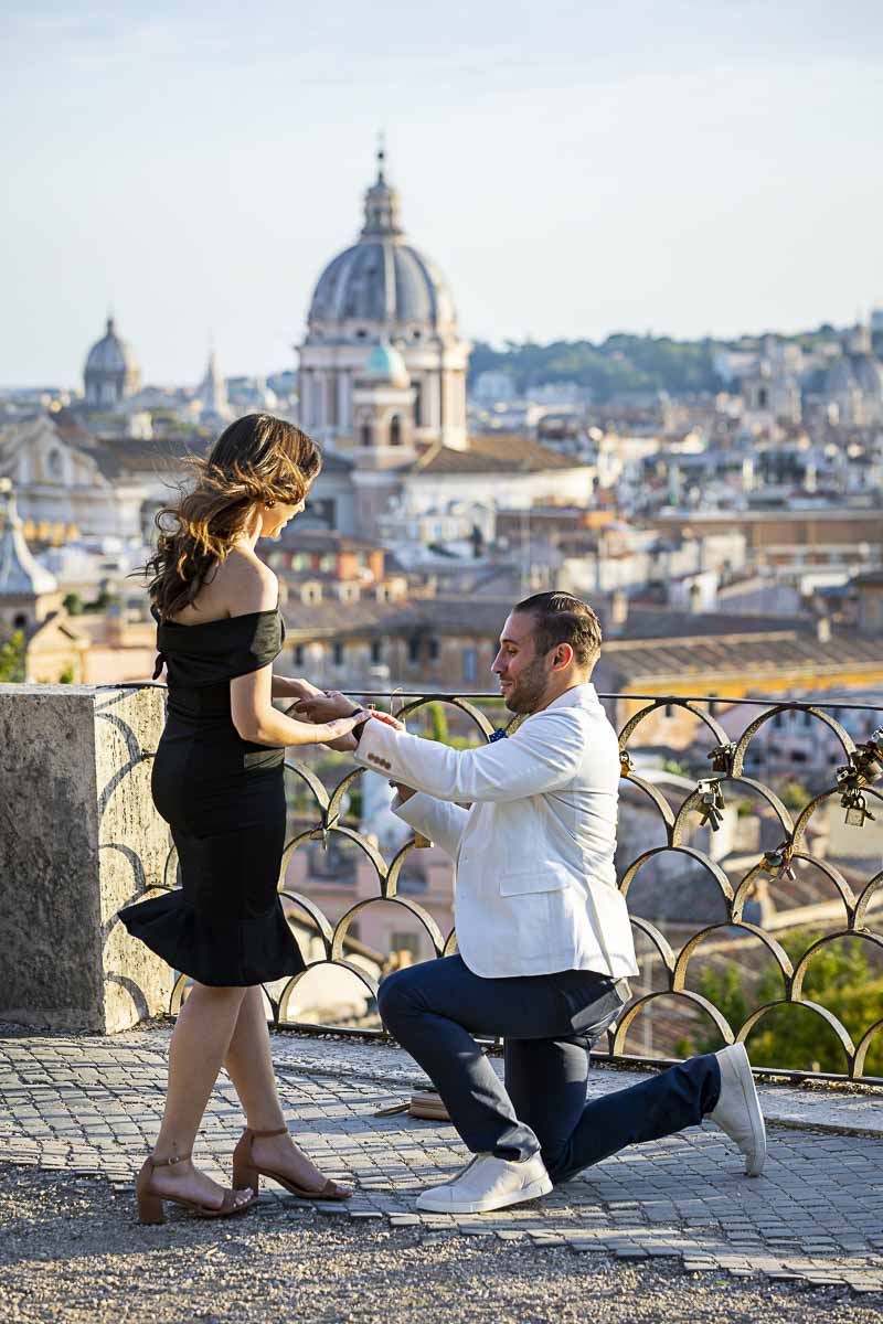 Man asking the big question overlooking the city of Rome from up above the Pincio sunset proposal in Rome