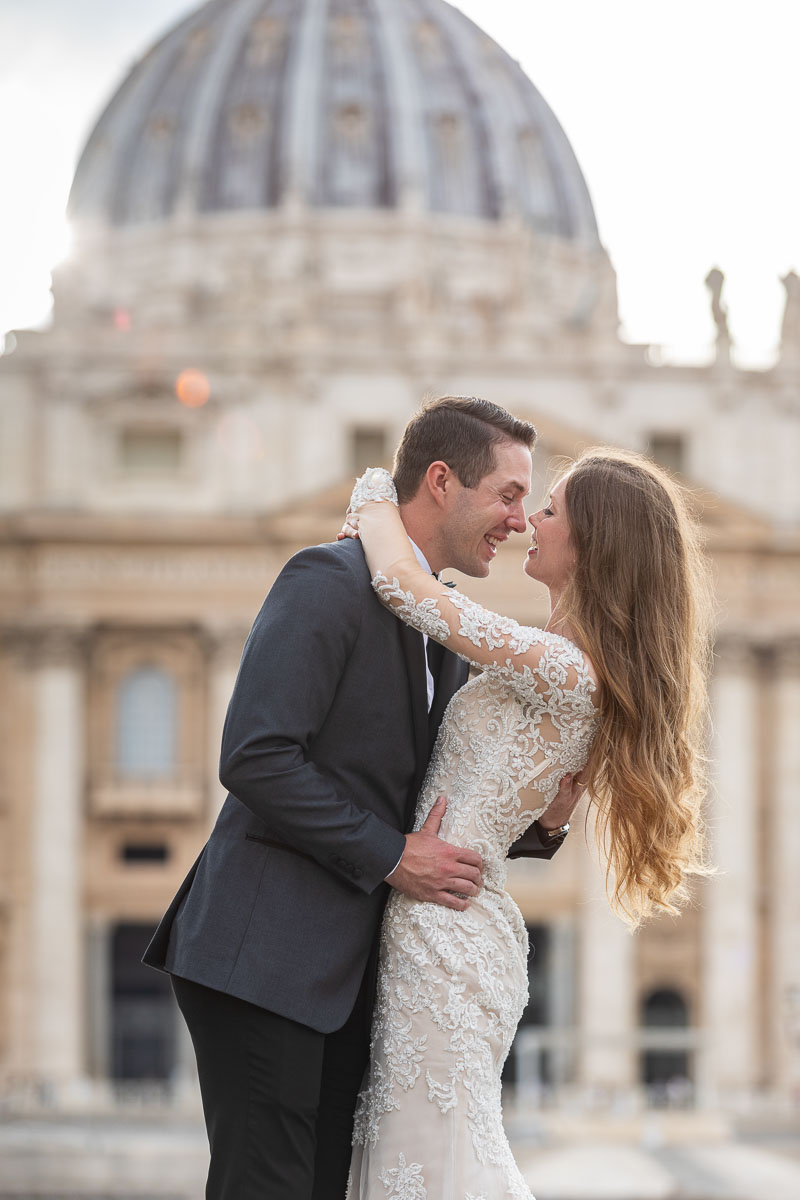 Couple portrait in marital clothing photographed in San Pietro. Honeymoon photo shoot in the Vatican