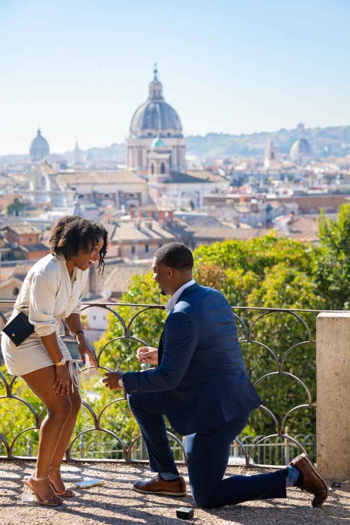 Proposing marriage overlooking the roman skyline from a scenic outlook found at the Pincio terrace panoramic terrace