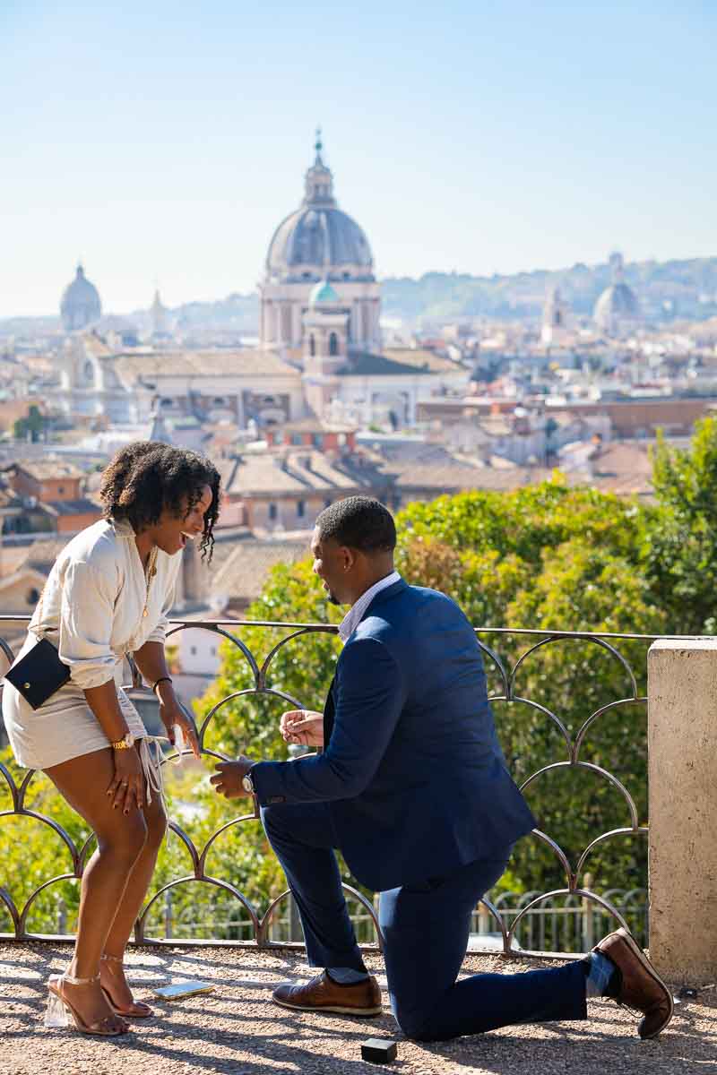 Proposing marriage overlooking the roman skyline from a scenic outlook found at the Pincio terrace panoramic terrace