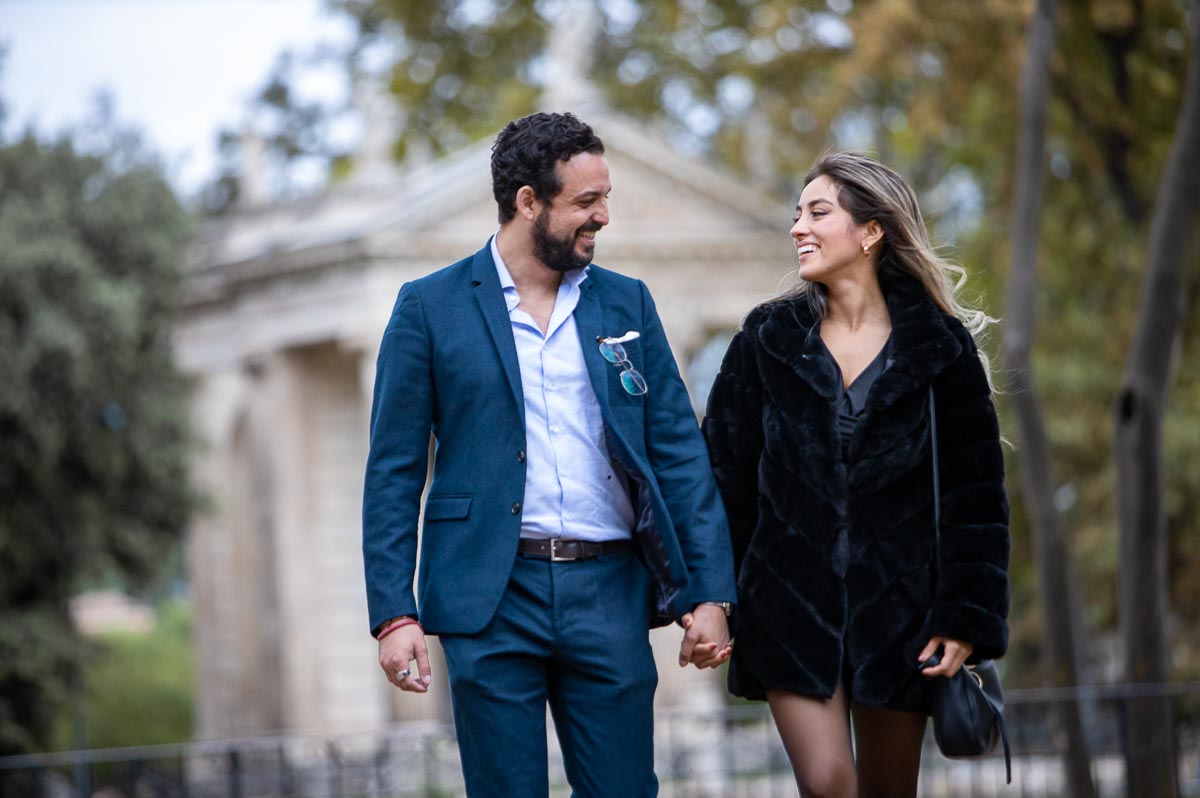 Walking together by the lake park in the roman streets 