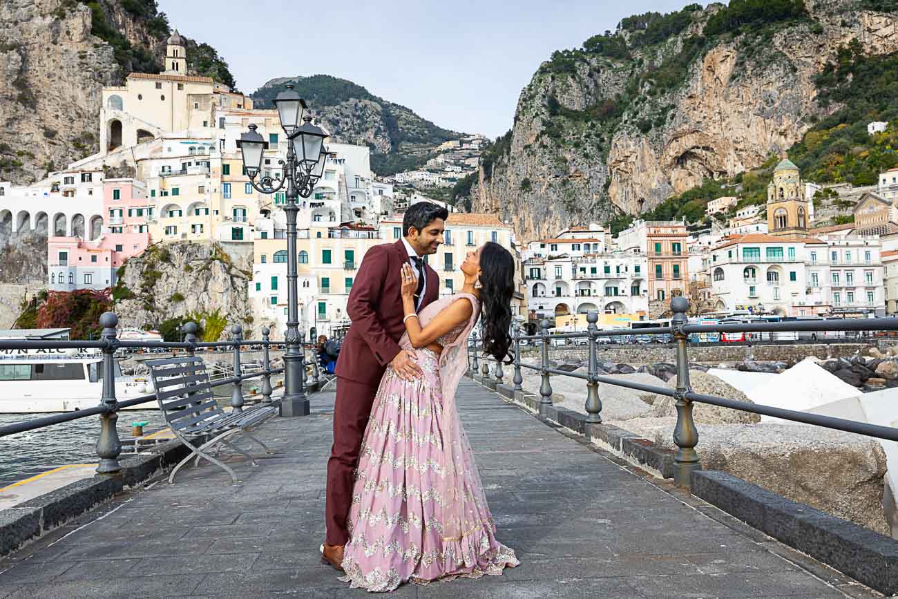 Posing pier taking pictures with the town in the far distance used as background. Couples Photo